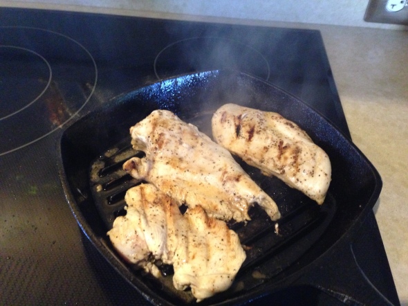 Grilling the chicken over high heat in my cast iron grill